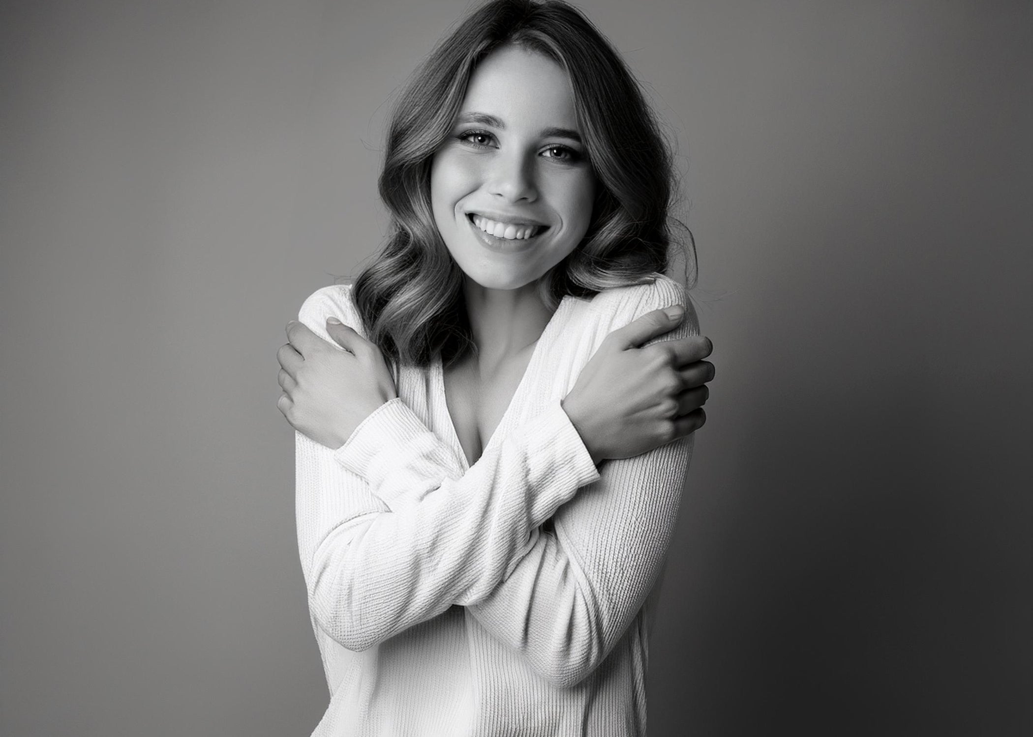 picture of women hugging herself and smiling
